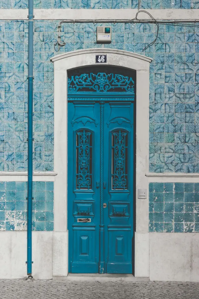 blue wooden door closed with 46 sign